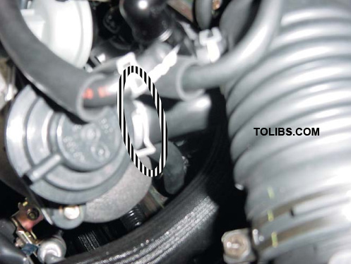 Loosen the bypass outlet hose clamp