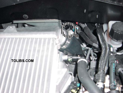 Loosen the hose clamp from the turbo outlet to the intercooler inlet