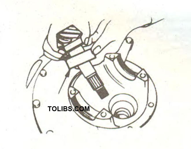 The arrow shows the dummy bearing on the pinion shaft
